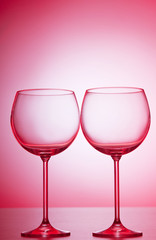 Wine glasses against gradient background