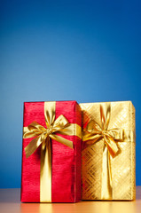 Celebration concept - Gift box against colorful background