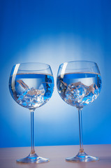 Water in the glass against gradient background