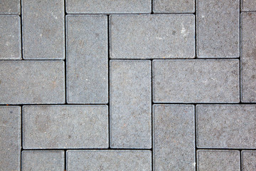 Fototapeta premium pavement pattern made with cast concrete blocks in grey color