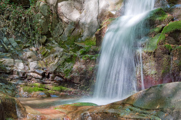 springtime waterfall in woods of Tuscany