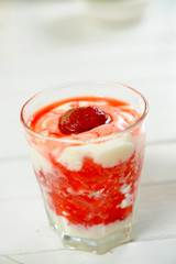 Fresh juicy strawberry with yogurt in a glass bowl
