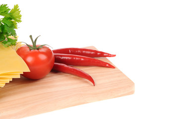 Lasagna pastawith tomato on cutting board