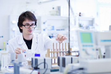 young male researcher carrying out scientific research in a lab
