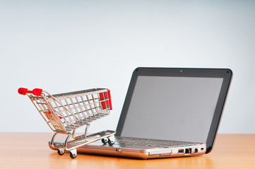Internet online shopping concept with computer and cart