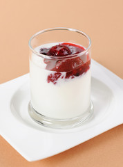 Dairy yogurt with a berry jam in the glass