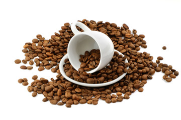 Coffee beans with small coffee cup