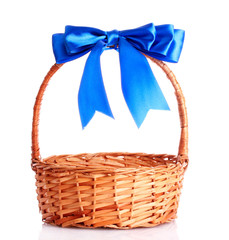 Fototapeta na wymiar basket with a blue bow isolated on white