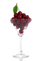 cherries in glass isolated on white background