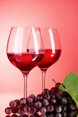 Wine bottle and glass on red background
