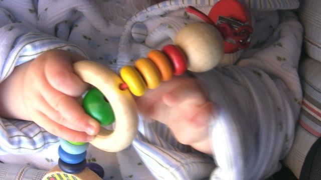 Baby Hands, playing with a toy