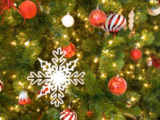 Red and White Christmas Ornaments on a Green Tree