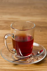 cup of black tea on wooden table