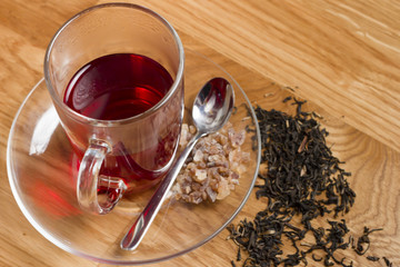 cup of black tea on wooden table