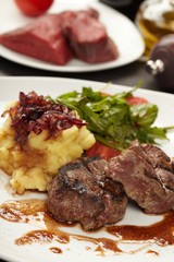 Beef steaks with vegetables