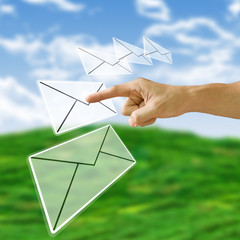 Finger pushing the letter with nature background,