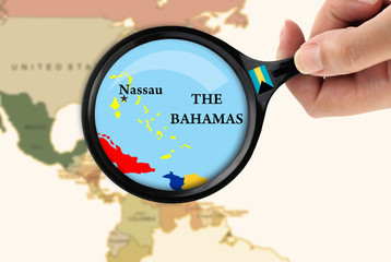 Magnifying glass over a map of the Bahamas