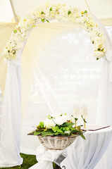 wedding arch and altar with wineglasses