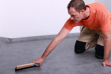 craftsman leveling the floor