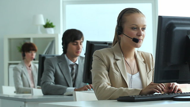 Row of call center operators at work