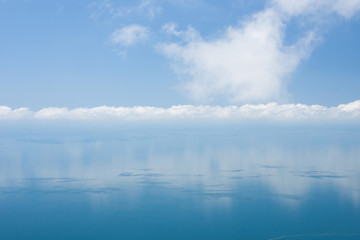 Obraz na płótnie Canvas The sea, the sky and clouds