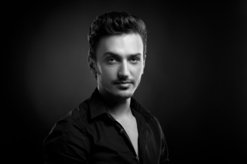 Obraz premium Young man's portrait in back