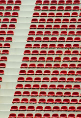 Obraz premium The red seats in the stadium.
