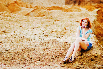 Fototapeta na wymiar Young redhead woman on beach