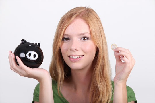 portrait of a young woman with money box