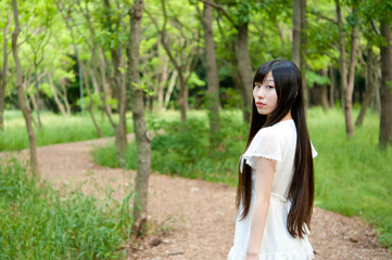 beautiful asian woman in the forest