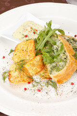 fish pie with sauce and potato chips