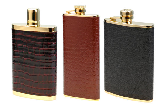 set of leather flasks for alcohol isolated on white
