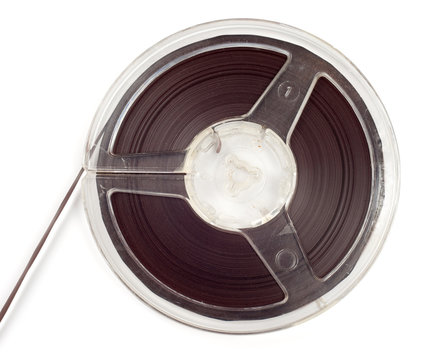 Plastic bobbin with magnetic tape isolated over white