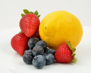 Fototapeta na wymiar Blueberries Stawberries Lemon