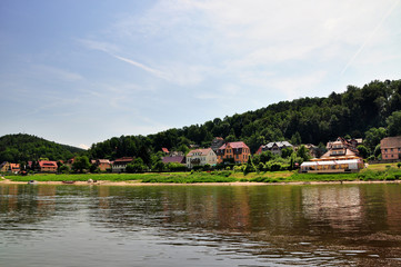 Fototapeta na wymiar Village on river