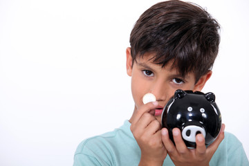 Boy with piggy bank