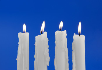 Candles isolated on blue background