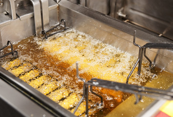 Deep fryer with oil on restaurant kitchen