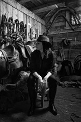 Cowgirl in the stables