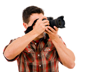 Young photographer with camera, isolated on white © cristovao31