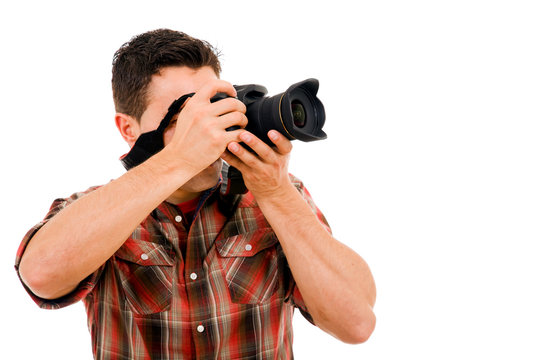 Young photographer with camera, isolated on white
