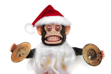 Vintage mechanical monkey toy with santa hat and beard