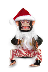 Vintage mechanical monkey toy with santa hat and beard