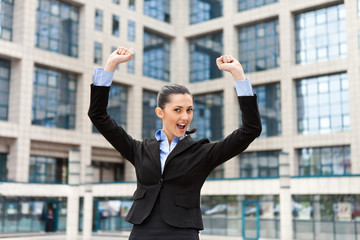 businesswoman with raising arms