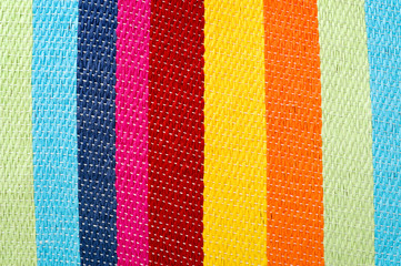 Multicolored striped canvas background, woven texture