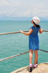 Asian kid on the shore