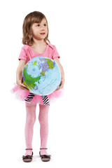 Little girl in pink with the inflatable ball-globe.