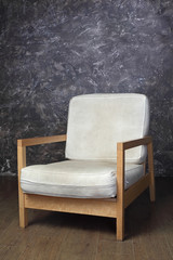 white chair in studio of photographer, brown background
