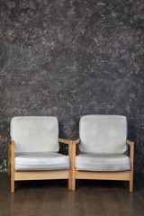 white chairs in studio of photographer, brown background