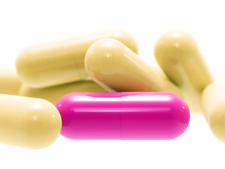 Pink and beige pills on white background, isolated